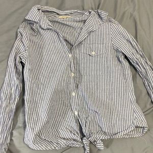 Blue and white striped button down T-shirt with pocket and tie